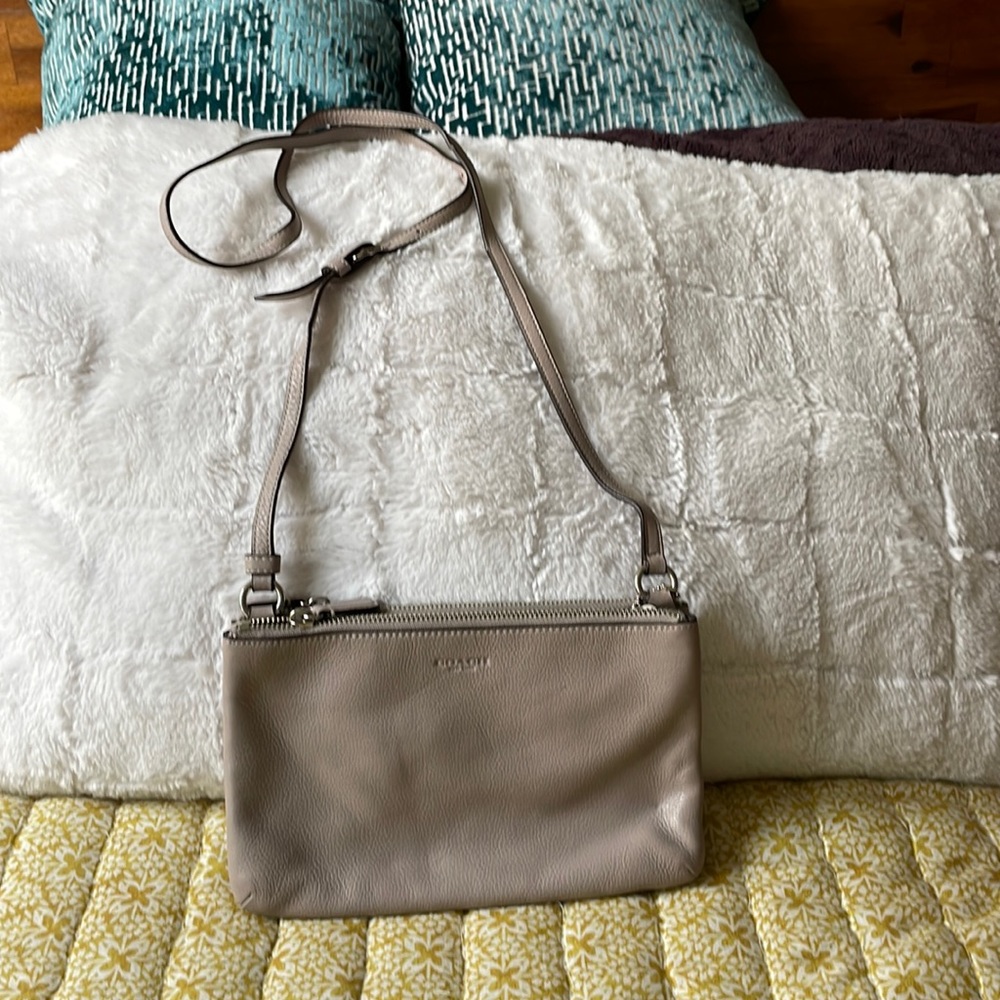 Leather Coach crossbody purse.